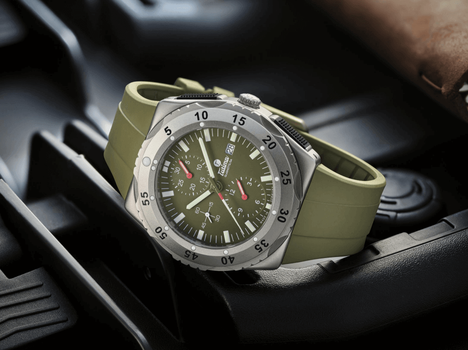 Contévanou wristwatch with olive green dial and silicone strap on black surface, mechanical chronograph design