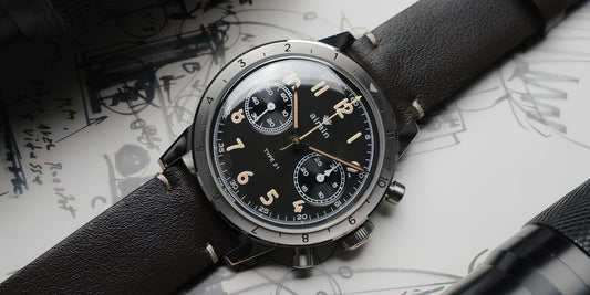 Contévanou airain TYPE 21 black dial watch with leather strap on sketches background, mechanical chronograph wristwatch