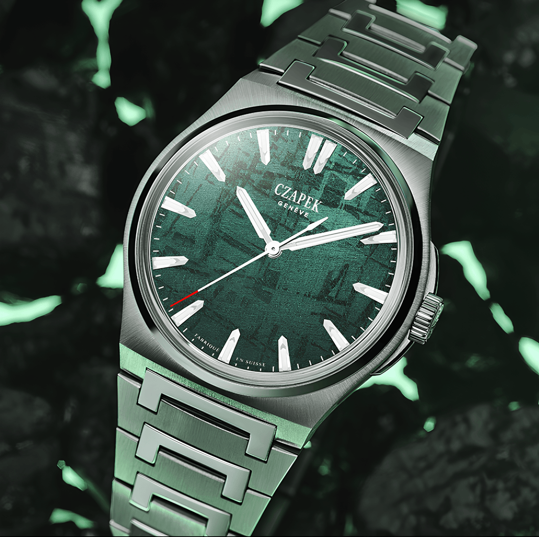 Luxury stainless steel watch with green textured dial and bold hour markers, close-up