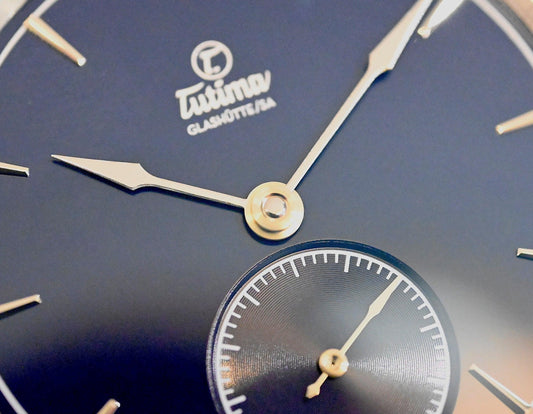 Close-up of Tutima Glashütte SA watch dial in deep blue with silver hands and detailed subdial