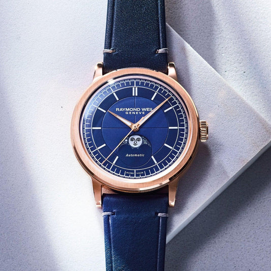 Contévanou Raymond Weil automatic watch with blue dial, moon phase indicator, rose gold case, and blue leather strap