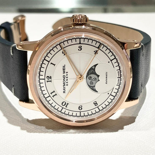 Raymond Weil Genève automatic wristwatch with moon phase display, rose gold case, and black leather strap