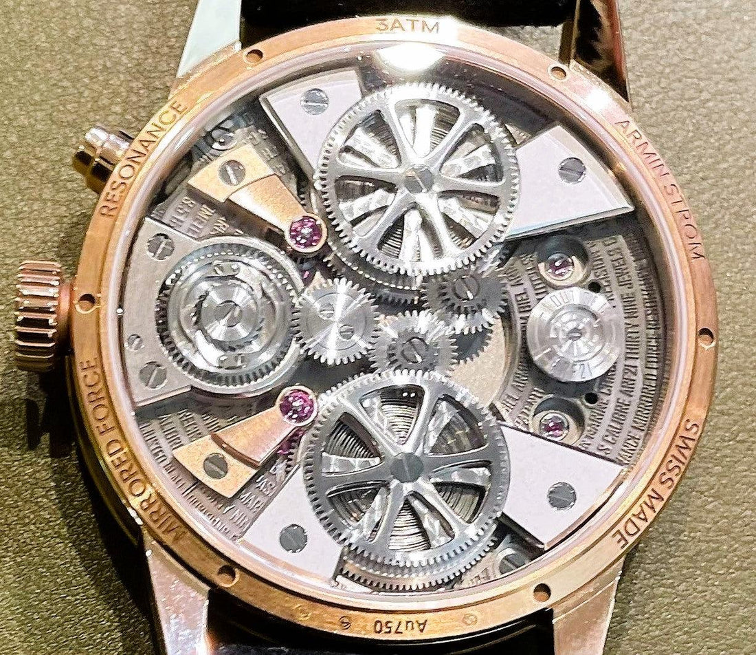 Close-up of Contévanou mechanical watch movement with intricate gears, jewels, and rose gold casing