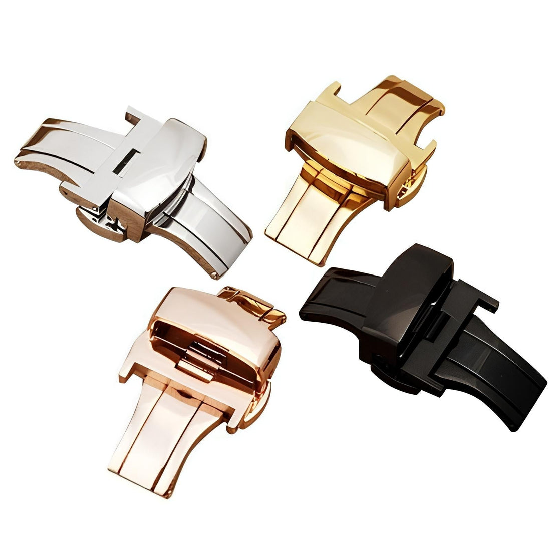 Four polished folding watch buckles in silver, gold, rose gold, and black against white background