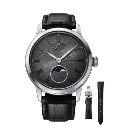 Luxury mechanical wristwatch with black leather strap, moonphase dial, and extra band
