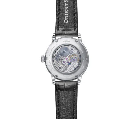 Luxury mechanical watch with transparent case back and black leather strap, showcasing movement.